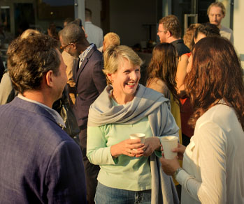 Community gathering and laughing outside